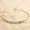 Rainbow Glass Bead and Chain Necklace in Gold on Cream Fabric