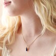 Model Wearing Sodalite Crystal Point Pendant Necklace in Gold