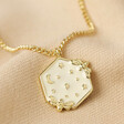 White Enamel Celestial Bee Pendant Necklace in Gold on Beige Fabric