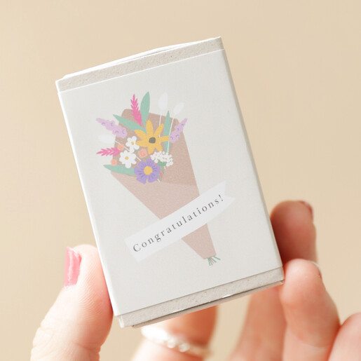 Model Holding Congratulations Tiny Matchbox Dried Flower Posy