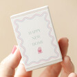 Model Holding Happy New Home Tiny Matchbox Dried Flower Posy