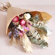 Rustic Dried Flower Bouquet Lying Flat on Pink Surface