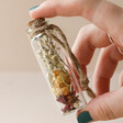 Model Holding Small Dried Flower Glass Bottle