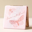 Pink Bee and Butterfly Bee-utiful Compact Mirror Propped Upright on Beige Surface