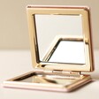 Open Pink Bee and Butterfly Bee-utiful Compact Mirror on Flat Surface