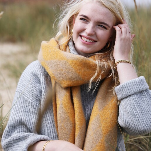 Smiling Blonde Model Wearing Personalised Mustard Harlequin Winter Scarf