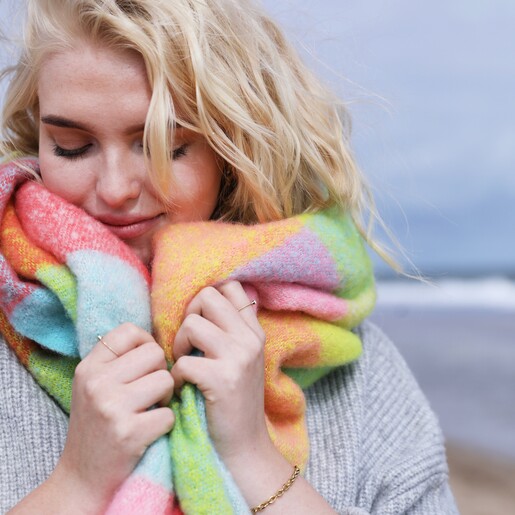 Blonde Model at Beach Wrapped Up in Neon Brights Check Winter Scarf