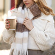 Close Up of Model Wearing Neutral Striped Winter Scarf