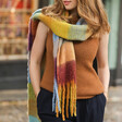 Model Wearing Personalised Burgundy and Mustard Check Winter Scarf over Knitted Brown Vest
