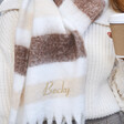Close Up of Model Wearing Personalised Neutral Striped Winter Scarf over White Jumper