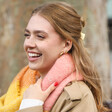 Close Up of Model Wearing Personalised Pink Sunset Block Winter Scarf