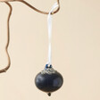 Small Oxford Blue Silver Glitter Bauble Hanging from Branch