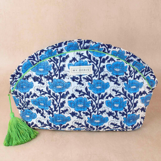 My Doris Blue Block Print Wash Bag Against a Neutral Coloured Background