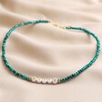 Teal Beaded Party Necklace in Gold on Natural Coloured Fabric