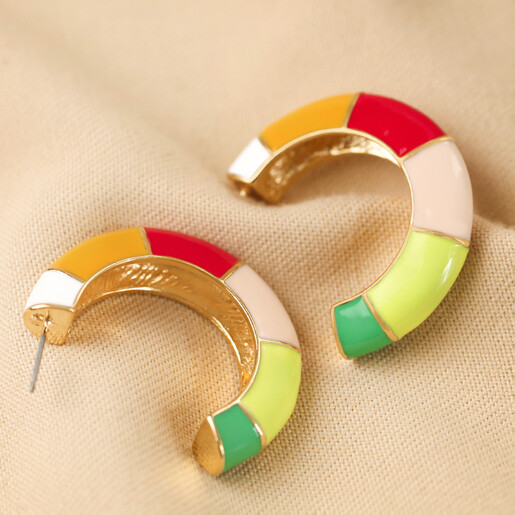 Colourful Enamel Striped Hoop Earrings in Gold Colourful Enamel Striped Hoop Earrings in Gold on Beige Fabric
