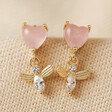 Pink Crystal Heart and Bee Drop Earrings in Gold on Beige Fabric