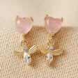 Pink Crystal Heart and Bee Drop Earrings in Gold on Beige Fabric