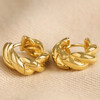 Rope Huggie Hoop Earrings in Gold on Beige Fabric