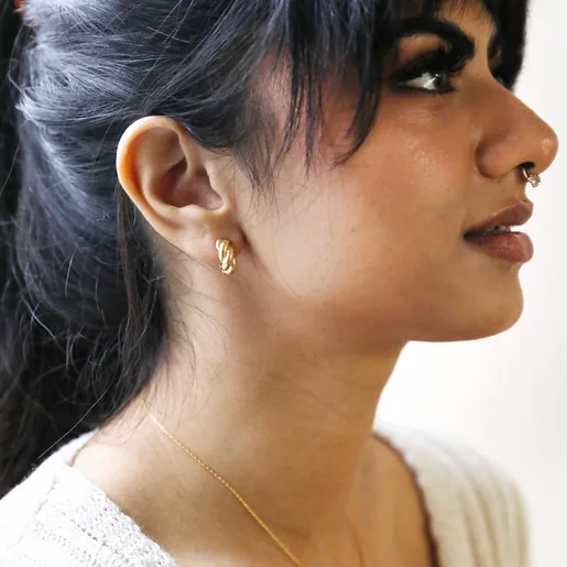 Brunette Model Wearing Rope Huggie Hoop Earrings in Gold