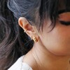 Rope Huggie Hoop Earrings in Gold Worn by Brunette Model