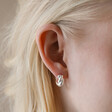 Close Up of Blonde Model Wearing Rope Huggie Hoop Earrings in Silver