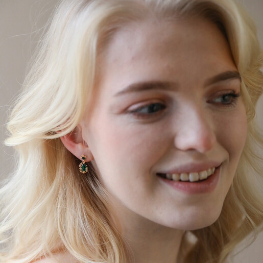 Small Gold Flower and Green Crystal Drop Earrings on Female Model