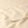 Tiny Seed Pearl Layered Chain Necklace in Gold on Neutral Coloured Fabric Full Length 