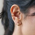 Model Wears Tiny Star Cut-Out Huggie Hoop Earrings With Celestial Ear Cuff