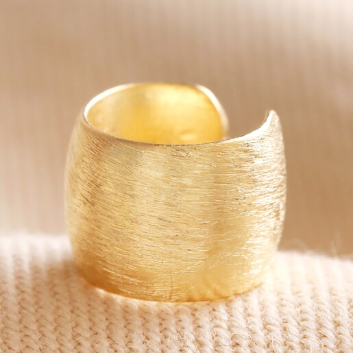Wide Brushed Ear Cuff in Gold on Beige Coloured Fabric