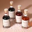 Personalised 100ml Merry Christmas Ports in tawny, ruby, rose and white on top of fake snow against neutral backdrop
