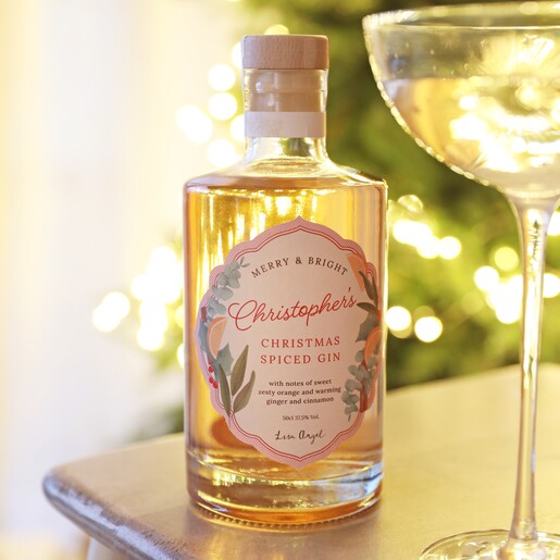 Personalised 500ml Christmas Spiced Gin on top of counter with glass in foreground