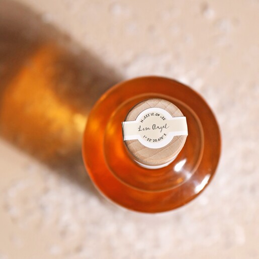 Top of Personalised 500ml Christmas Spiced Gin bottle with cream backdrop and fake snow