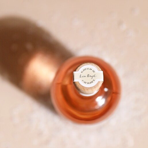 Top of Personalised 500ml Festive Orange Gin bottle on top of cream surface with fake snow