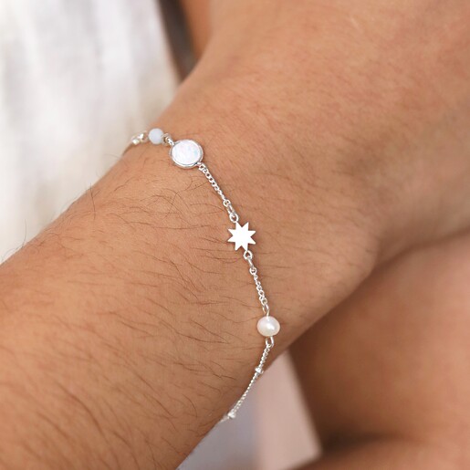 Close Up of Model Wearing Pearl and Crystal Moon and Stars Bracelet in Silver