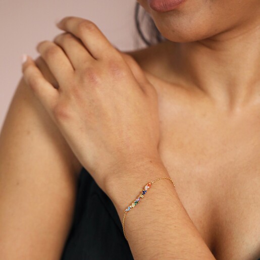 Bracelet on Model Model Wearing Rainbow Baguette Crystal Bar Bracelet in Gold