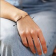 Sun and Moon Cord Bracelet in Gold on Model's Wrist