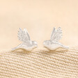 Delicate Bird Stud Earrings in Silver on Beige Fabric