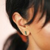 Close up of Green Stone Bar Stud Earrings in Gold on model