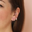 Pastel Baguette Crystal Huggie Hoop Earrings in Silver with curated earring set on model