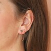Shell and Crystal Star Chain Stud Earring in Gold on brown haired model