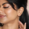Close Up of Thread Through Crystal and Pearl Chain Earrings in Gold on Model