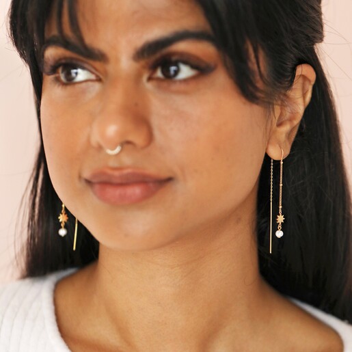 Thread Through Star and Pearl Chain Earrings in Gold on Model