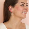 White Enamel Twisted Hoop Earrings in Gold on Model