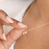 Close up of model wearing the Delicate Bird Pendant Necklace in Gold