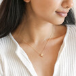 Model wearing the Delicate Bird Pendant Necklace in Gold
