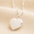 Heart Locket Necklace in Silver on Beige Fabric