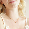 Shell Moon and Star Pendant Necklace in Gold on Model