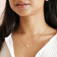 Pearl and Crystal Moon and Stars Necklace in Gold on model