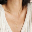 Close Up of Crescent Moon Pendant Necklace in Gold on Model