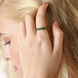 Adjustable Green Baguette Crystal Band Ring in Gold on blonde model with hand in hair